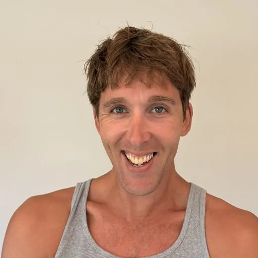 Kylen in a gray tank top pulling a face for the camera, photo booth shot 10 of 12