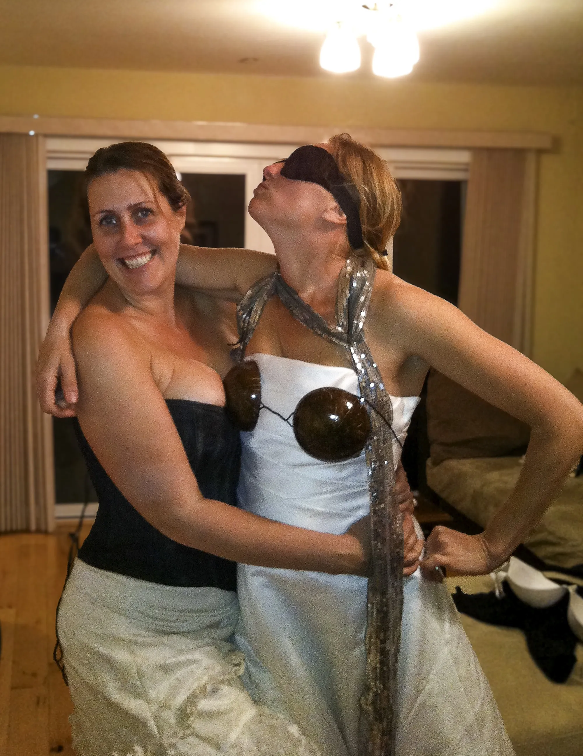 Kenda and Georgia in wedding dresses at a house party, the night The Divorce Dress began